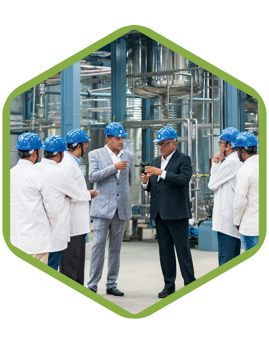 Pharmaceutical manufacturing experts inspecting production line